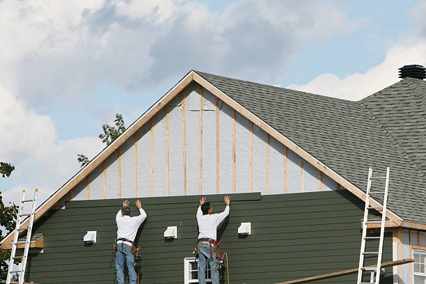 Professional Emergency Siding Repair technician working in Amherst, TX